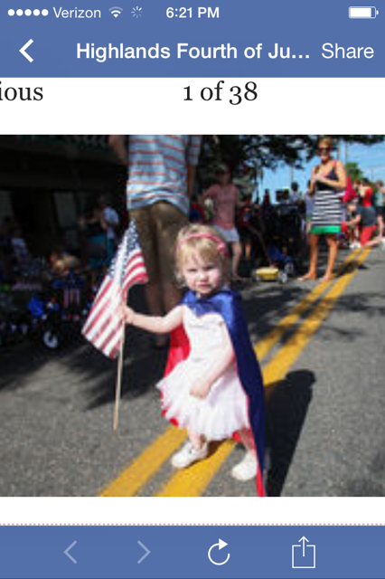 Devon Cox, Michael (Mickey) Cox' granddaughter leading the way in the Highlands, CO - 4th of July parade.